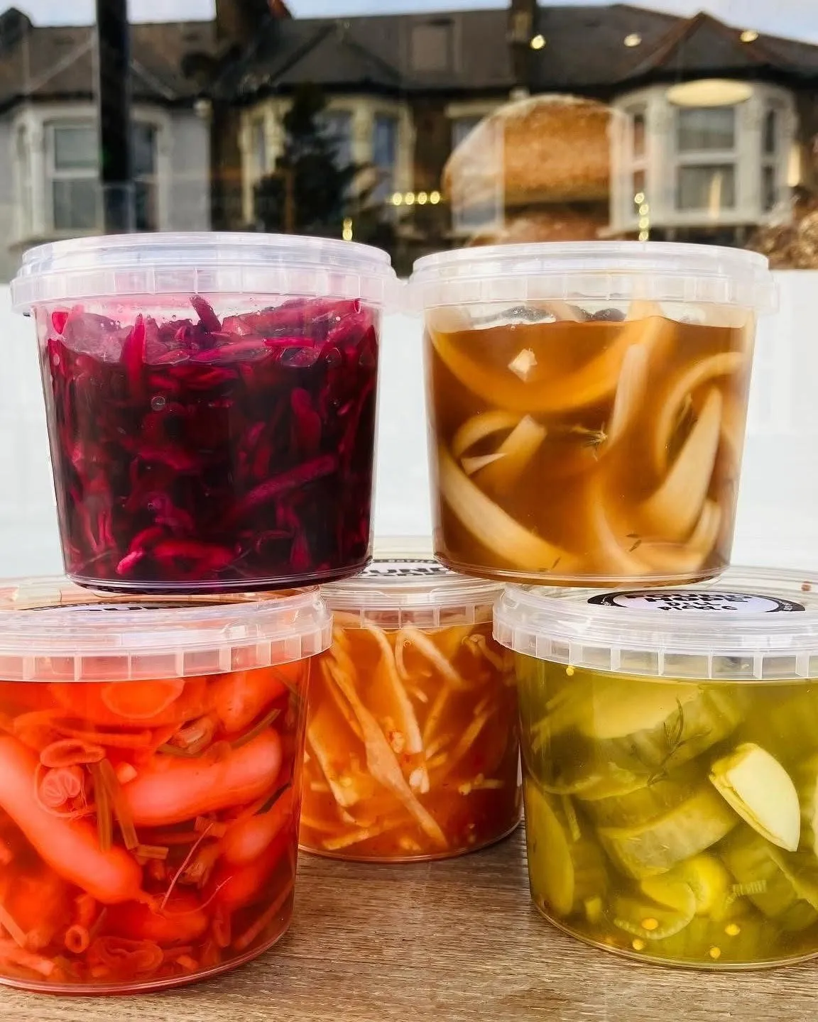 Tubs of our own pickles in the shop window